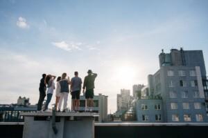 people standing on top of building