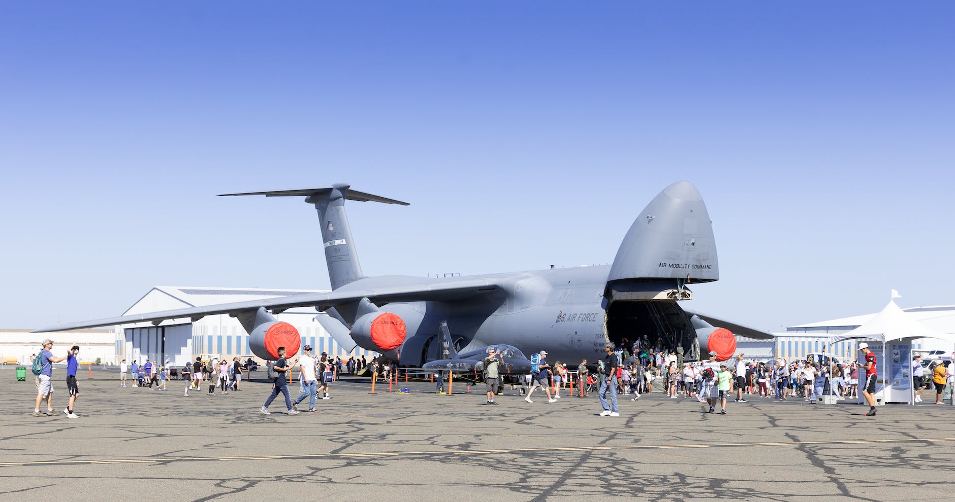 old military airplane on a runway open to visitors