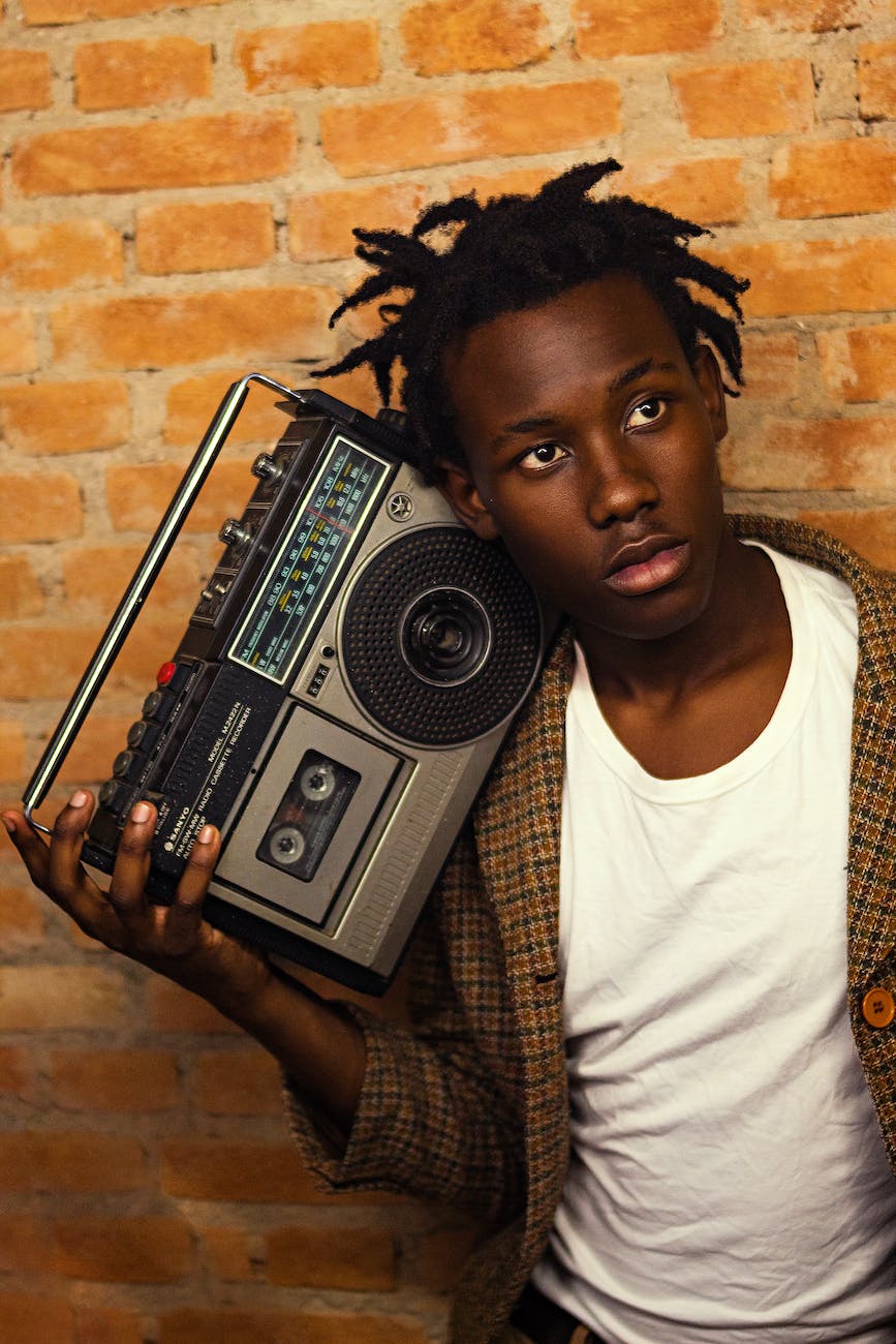 photo of man holding stereo