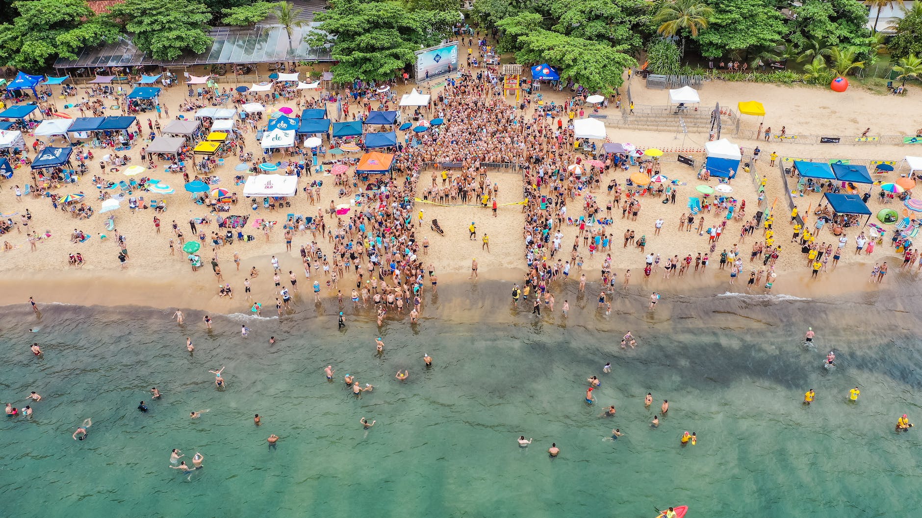 people preparing for swim challenge on seashore