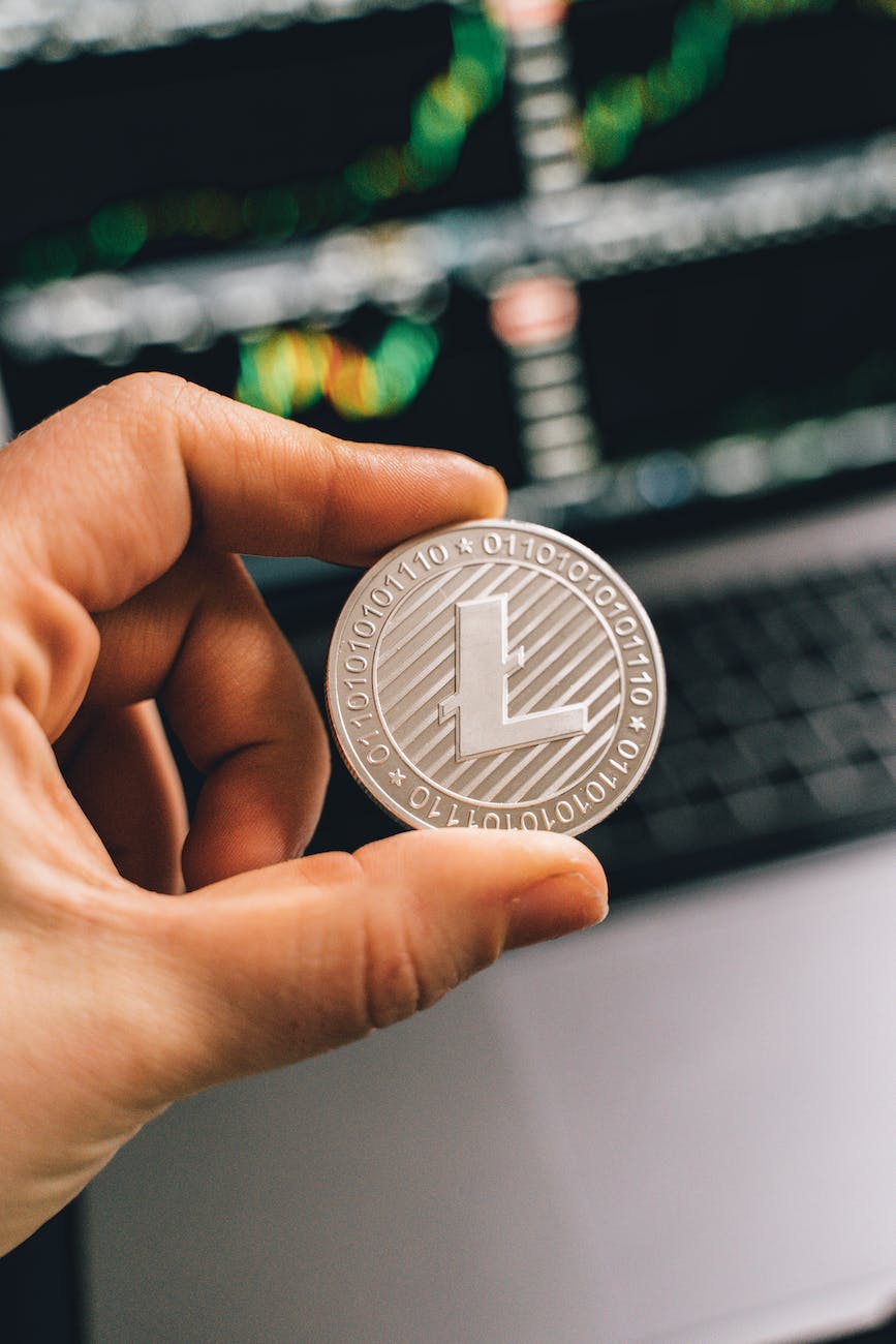 a person holding a silver coin