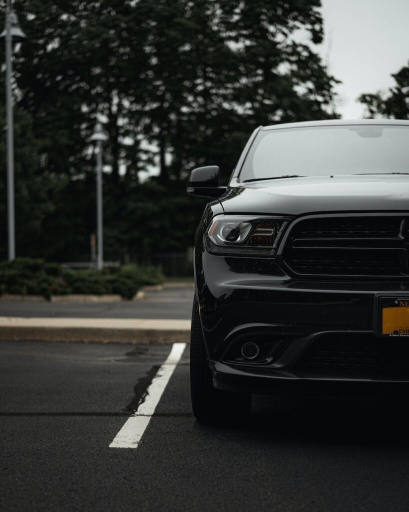 black suv parked in a parking lot