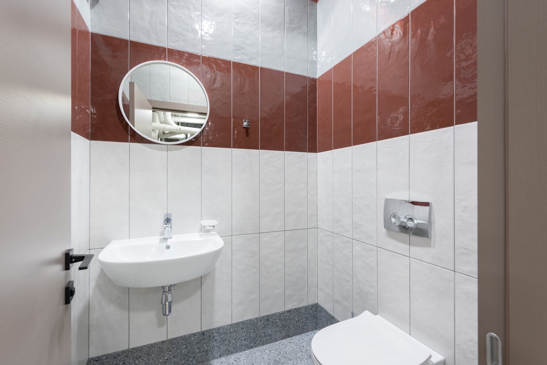 interior of modern restroom with tiled walls