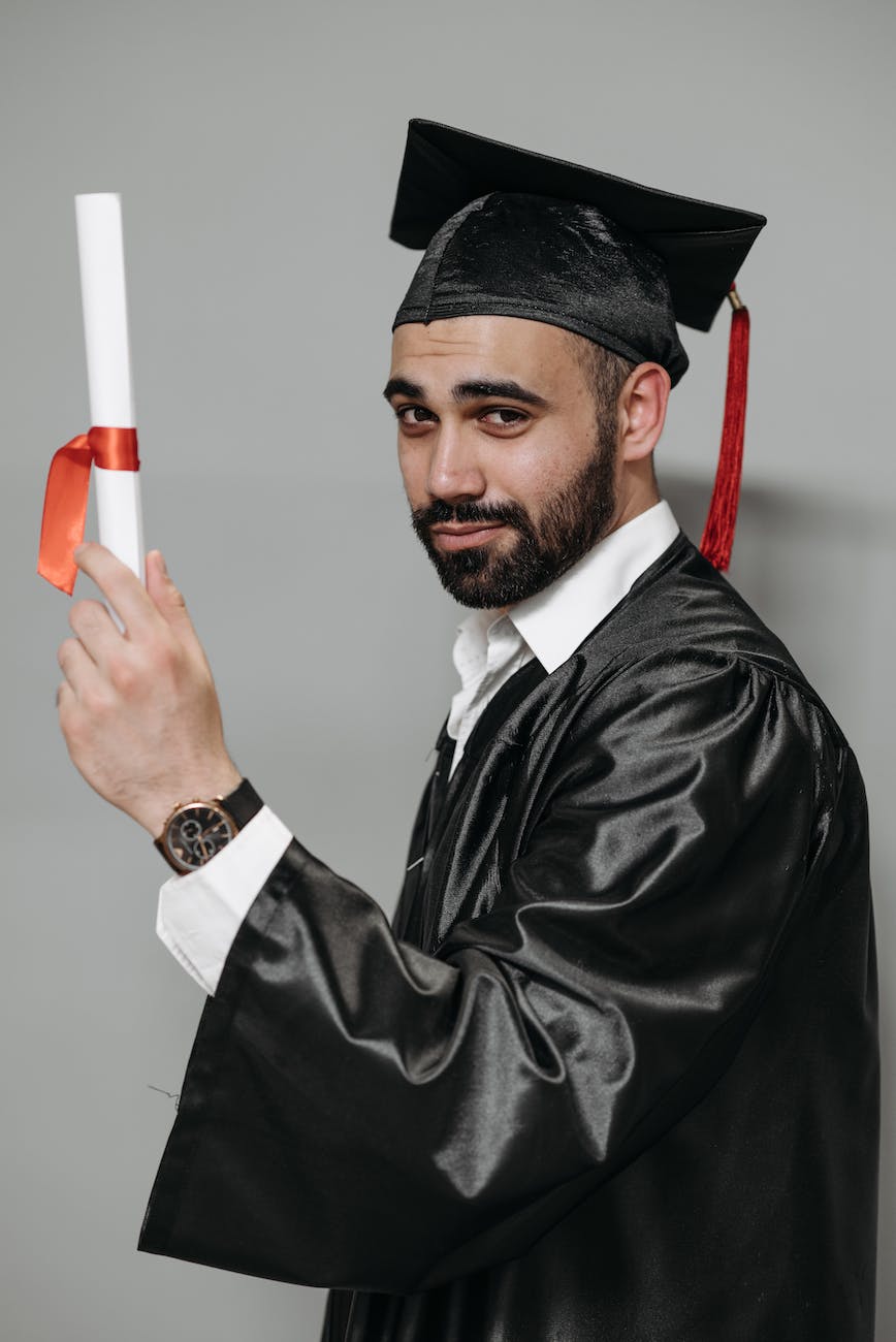 photo of man in black academic gown