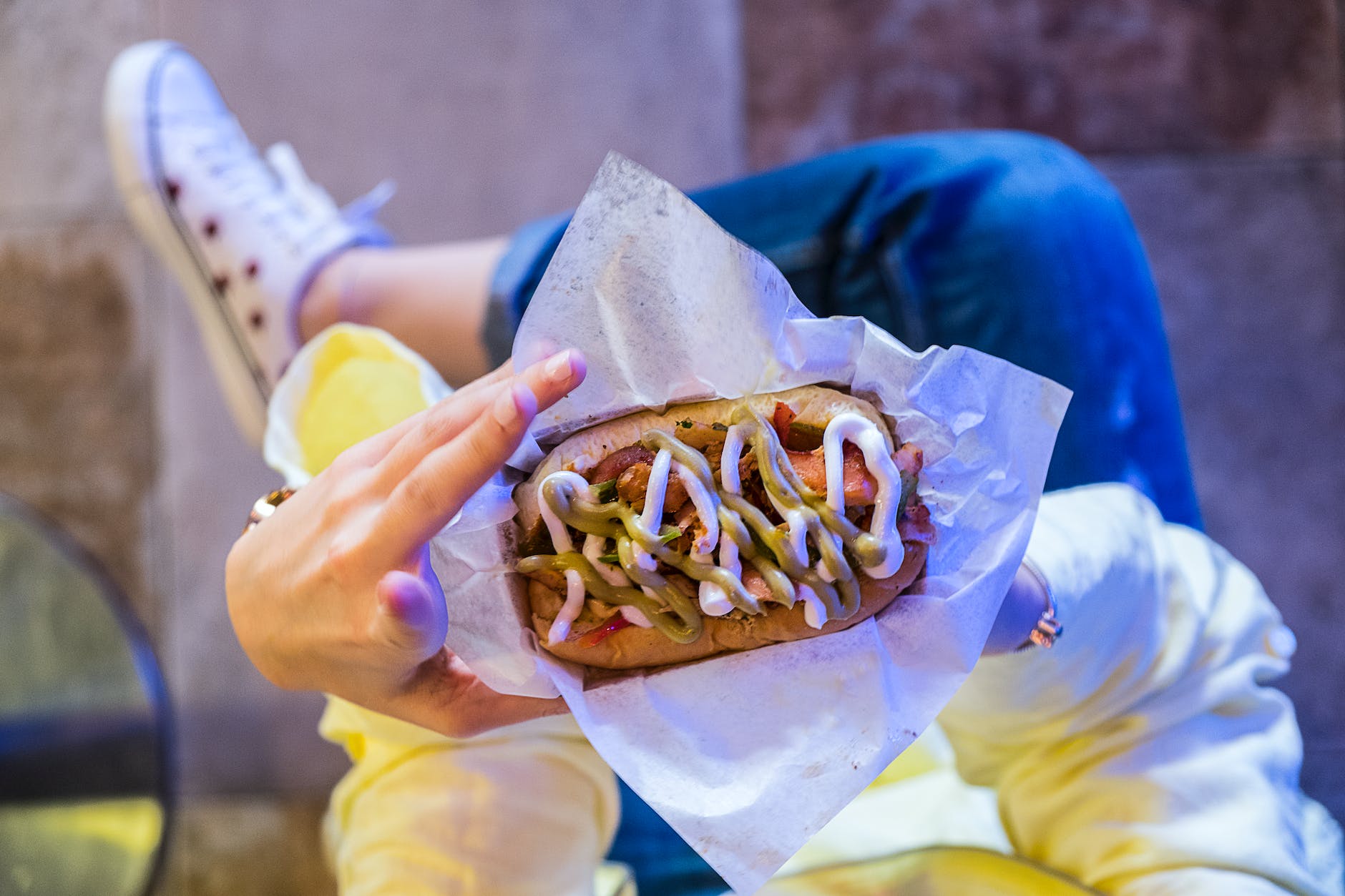 woman holding burger