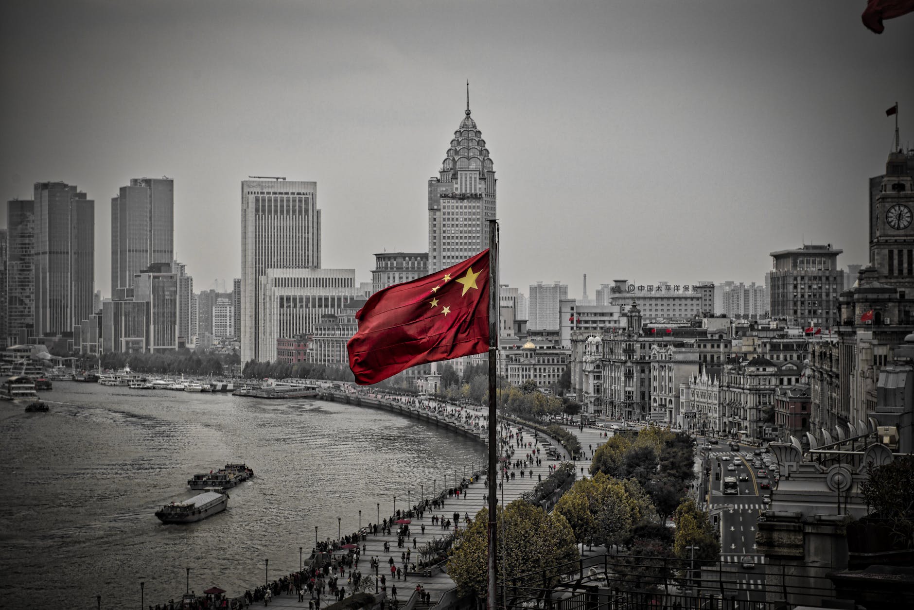 chinese flag flying above city
