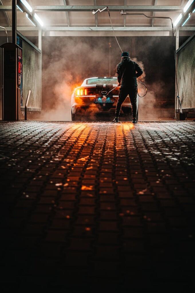 car being wash by man