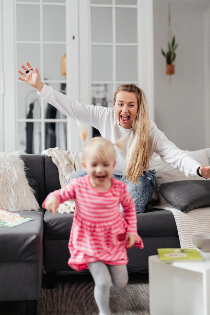 mother chasing daughter in room