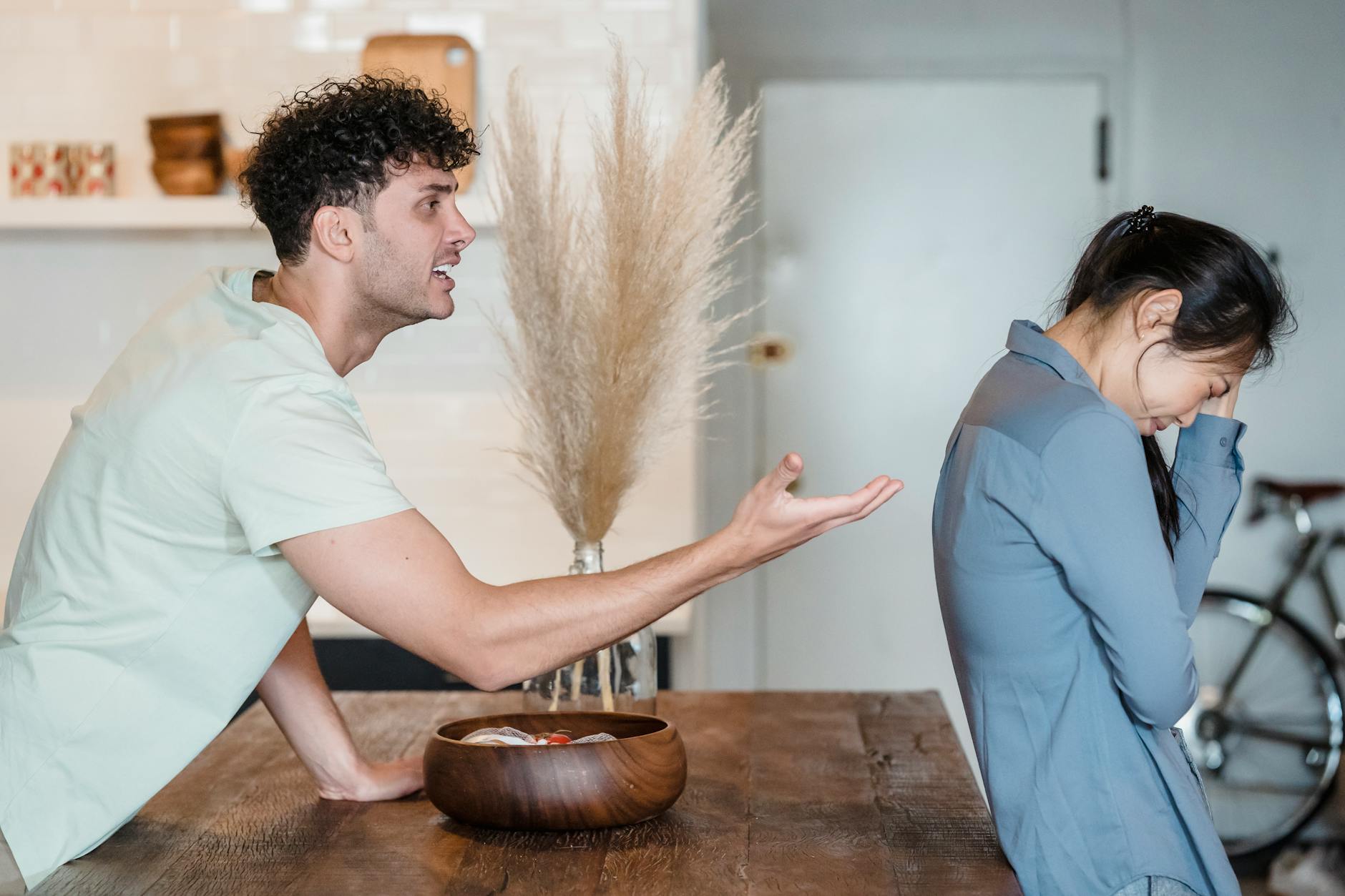 a man talking to his upset partner