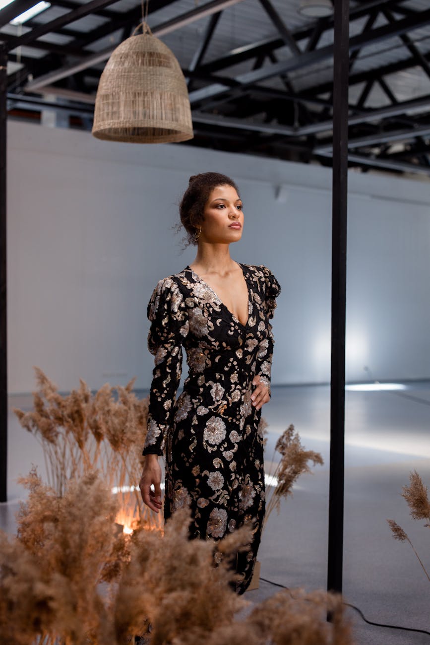 photograph of a runway model in a black dress