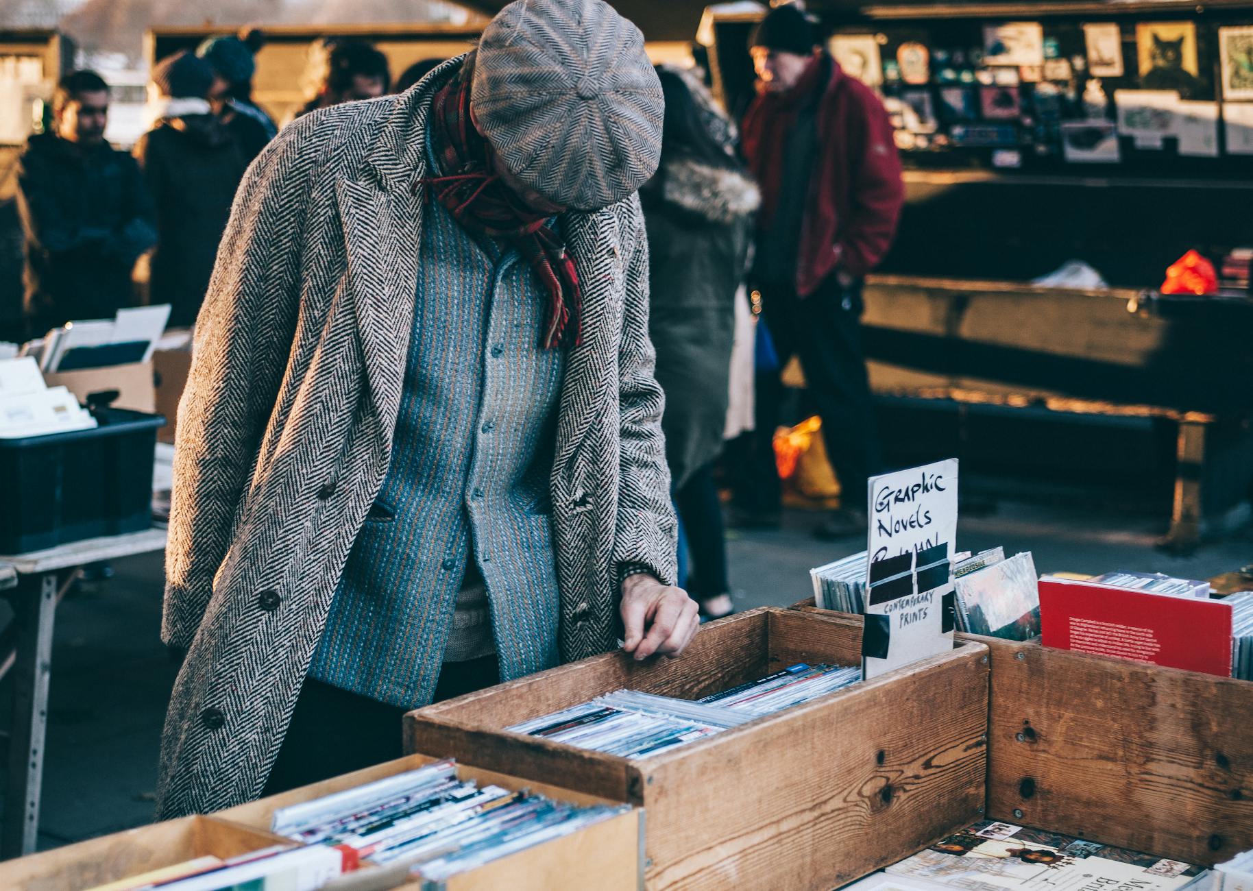 person standing in front of brown crate