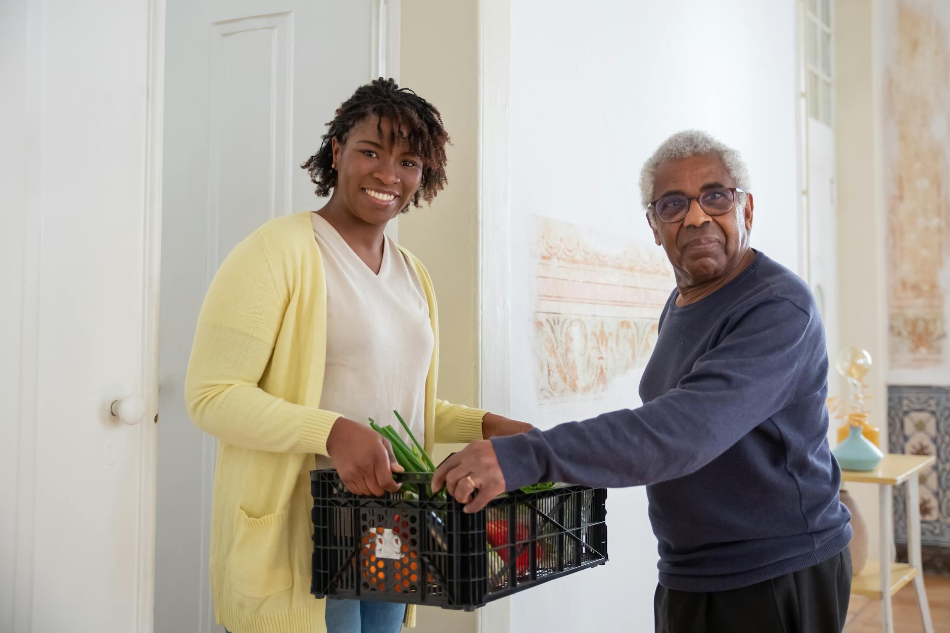 a man and woman holding a plastic crater