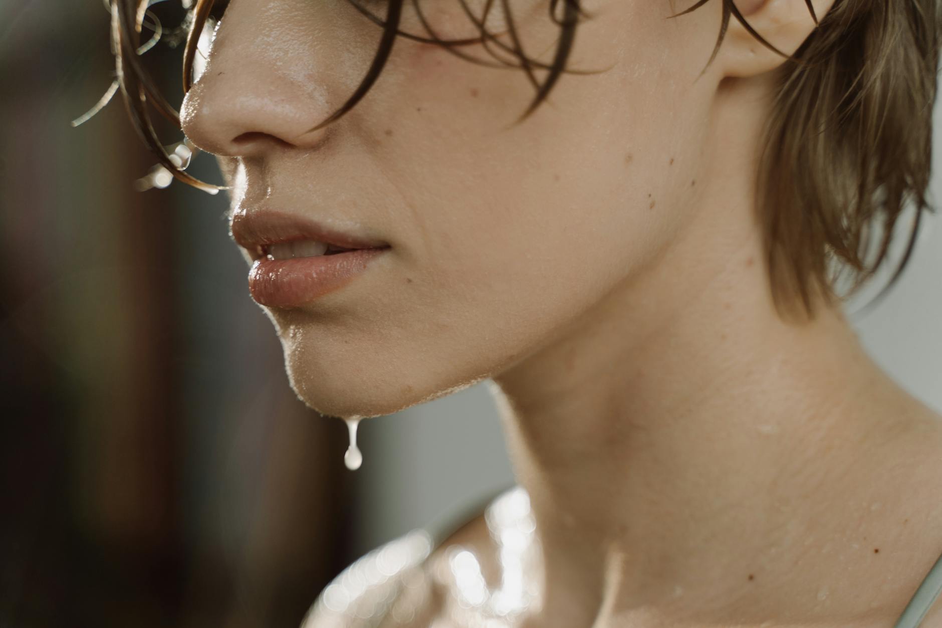 sweaty woman in close up photography