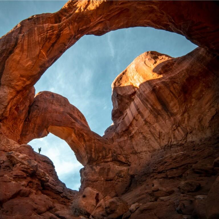 brown rock formation under white clouds and blue sky during daytime