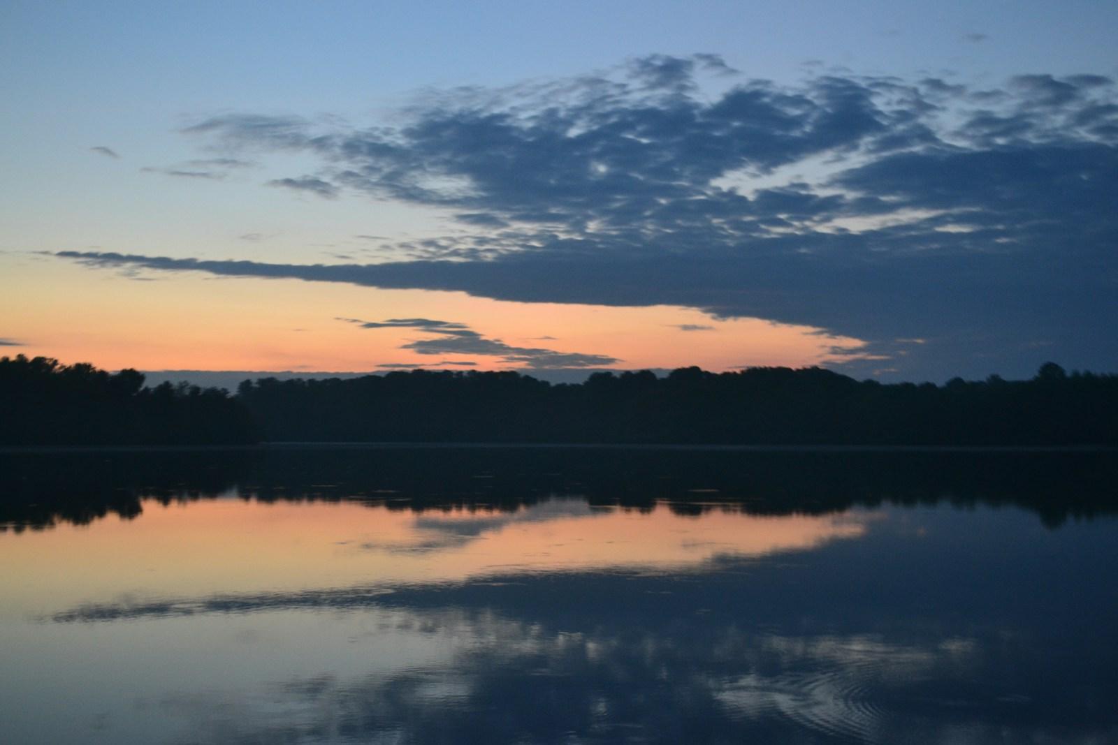 body of water under cloudy sky during daytime