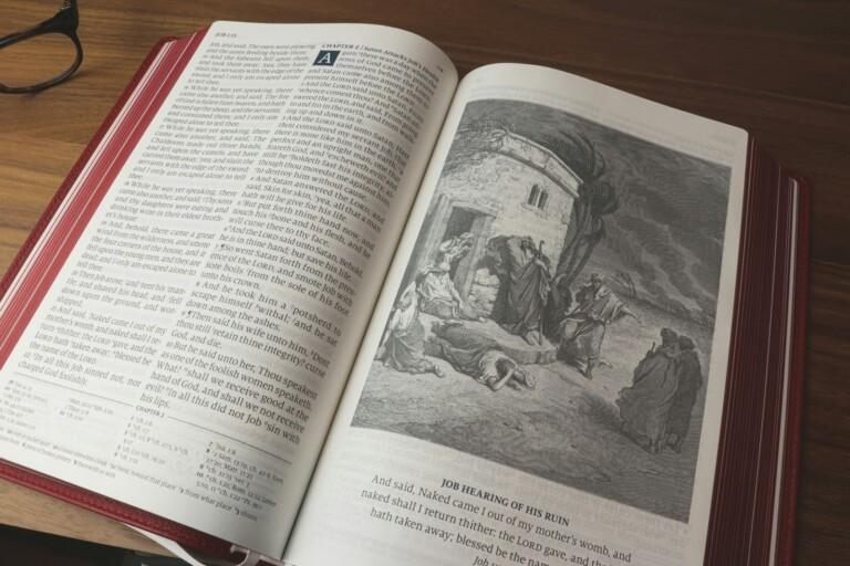 white book page on brown wooden table